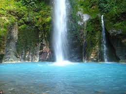 Nungnung Waterfall in Bali’s highlands with heavy water flow